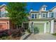 Charming townhome featuring a green garage door and lush landscaping at 1823 Chauncys Ct, Mount Pleasant, SC 29466