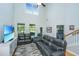 Bright living room features high ceilings, comfortable seating, and a decorative fireplace at 1823 Chauncys Ct, Mount Pleasant, SC 29466