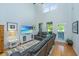 Bright living room with high ceilings, large windows, hardwood floors, and modern furnishings at 1823 Chauncys Ct, Mount Pleasant, SC 29466