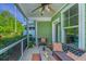 Relaxing screened-in porch with outdoor seating and views of the well-maintained landscape at 1823 Chauncys Ct, Mount Pleasant, SC 29466