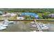 Aerial scene of marina and waterways including many boats docked with waterway access and waterfront living at 1880 Andell Bluff Blvd # F-3, Seabrook Island, SC 29455