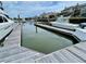 View of boat docked on boat lift next to waterfront houses at 1880 Andell Bluff Blvd # F-3, Seabrook Island, SC 29455