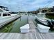 Docked boats on boat lifts with water view and houses at 1880 Andell Bluff Blvd # F-3, Seabrook Island, SC 29455