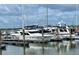 Several yachts docked in slips on the water, under cloudy skies at 1880 Andell Bluff Blvd # F-3, Seabrook Island, SC 29455