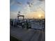 Marina views of boats docked with the sun setting in the background, featuring an attractive boating lifestyle at 1880 Andell Bluff Blvd # F-3, Seabrook Island, SC 29455