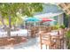 Picturesque outdoor seating area with colorful umbrellas, perfect for enjoying a meal at 1880 Andell Bluff Blvd # F-3, Seabrook Island, SC 29455