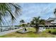 Scenic water view featuring a dock, lawn, lounge chairs, and nearby dining at 1880 Andell Bluff Blvd # F-3, Seabrook Island, SC 29455