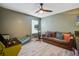 A multifunctional bonus room with couch, exercise machine, and arcade game at 1901 Toland Ct, Johns Island, SC 29455