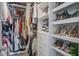 Well-organized walk-in closet with shelving and hanging space for clothes and shoes at 1901 Toland Ct, Johns Island, SC 29455