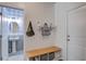 Welcoming entryway with bench seating, storage, and easy access to the powder room at 1901 Toland Ct, Johns Island, SC 29455