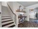 Elegant entryway with wood floors, stairs, and stylish decor on a bicycle-themed table at 1901 Toland Ct, Johns Island, SC 29455