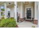 Inviting front porch with decorative accents, comfortable seating, and charming curb appeal at 1901 Toland Ct, Johns Island, SC 29455