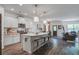 Modern kitchen with a spacious island, white cabinetry, and stainless steel appliances at 1901 Toland Ct, Johns Island, SC 29455