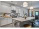 Open kitchen boasts granite countertops, a large island with seating, and stainless appliances at 1901 Toland Ct, Johns Island, SC 29455