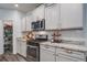 Modern kitchen featuring stainless steel appliances, granite countertops, and white cabinets at 1901 Toland Ct, Johns Island, SC 29455