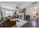 Comfortable living room with fireplace, ceiling fan, and lots of natural light at 1901 Toland Ct, Johns Island, SC 29455