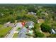 Beautiful aerial view of a green home with a pool and lush surrounding landscape at 2009 Terrabrook Ln, Charleston, SC 29412