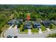 Aerial view of the house featuring mature trees, a manicured lawn, and neighboring houses in the community at 2009 Terrabrook Ln, Charleston, SC 29412