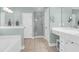 Bathroom featuring a tub, walk-in shower, and vanity with good lighting and a mirror at 2009 Terrabrook Ln, Charleston, SC 29412