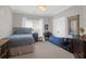 Cozy bedroom featuring a comfortable bed, work station, closet, and bright natural light at 2009 Terrabrook Ln, Charleston, SC 29412