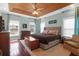 Bright bedroom with a wood ceiling, large bed, hardwood floors, and natural light at 2009 Terrabrook Ln, Charleston, SC 29412