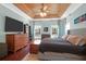Well-lit bedroom featuring wood ceiling, hardwood floors, ceiling fan, and a comfortable bed at 2009 Terrabrook Ln, Charleston, SC 29412