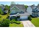 Charming two-story home with a well-manicured lawn and an attached garage at 2009 Terrabrook Ln, Charleston, SC 29412