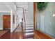 Bright foyer featuring hardwood floors, a staircase, and a view of the living space at 2009 Terrabrook Ln, Charleston, SC 29412