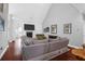 Bright living room with vaulted ceiling, fireplace, and oversized comfortable seating at 2009 Terrabrook Ln, Charleston, SC 29412