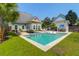 Inviting backyard oasis with pool, lounge chairs, and outdoor bar area perfect for relaxing and entertaining at 2009 Terrabrook Ln, Charleston, SC 29412