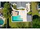 Aerial shot of a modern backyard pool with sun loungers and entertaining area at 2009 Terrabrook Ln, Charleston, SC 29412