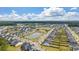 Stunning aerial view of community near a pond, green space, and mature trees providing a serene backdrop at 206 Evergreen Ave, Summerville, SC 29485