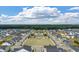 Aerial view of community with a pond, green space, and rows of houses showcasing community planning at 206 Evergreen Ave, Summerville, SC 29485