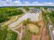 Aerial view of a community featuring a pond with walking trails and a recreational area at 206 Evergreen Ave, Summerville, SC 29485