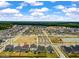 Aerial shot of a residential neighborhood with a playground, pond, and green spaces at 206 Evergreen Ave, Summerville, SC 29485