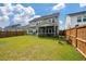 Beautifully landscaped backyard with mature trees and a well-maintained lawn at 206 Evergreen Ave, Summerville, SC 29485