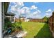 Spacious backyard featuring a storage shed, lush lawn, and beautiful landscaping at 206 Evergreen Ave, Summerville, SC 29485