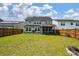 Expansive backyard with lush green lawn, perfect for outdoor entertaining and recreation at 206 Evergreen Ave, Summerville, SC 29485