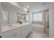 Bathroom has white cabinets, double sinks, and a separate tub and shower at 206 Evergreen Ave, Summerville, SC 29485