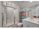 Bright bathroom featuring a glass enclosed shower, white vanity, and modern fixtures at 206 Evergreen Ave, Summerville, SC 29485