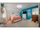 Cozy bedroom featuring an accent wall, a comfortable bed, and ample natural light at 206 Evergreen Ave, Summerville, SC 29485