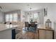 Charming dining area adjacent to kitchen with views of an outdoor space from the bright windows at 206 Evergreen Ave, Summerville, SC 29485