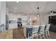 Bright open kitchen showcasing an island with seating, stainless steel appliances, and ample cabinet space at 206 Evergreen Ave, Summerville, SC 29485