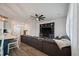Open-concept living room boasts stylish decor, including a large sectional sofa and shiplap accent wall at 206 Evergreen Ave, Summerville, SC 29485