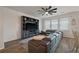 Comfortable living room features a sectional sofa, entertainment center and natural light streaming through the large windows at 206 Evergreen Ave, Summerville, SC 29485