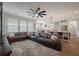 Spacious open-concept living room with sectional sofa, view of dining area and large windows at 206 Evergreen Ave, Summerville, SC 29485