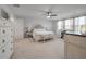 Spacious bedroom with nice trim, a crib, a ceiling fan, and light-colored carpet at 206 Evergreen Ave, Summerville, SC 29485