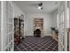 Home office with French doors, stylish rug, built-in bookcase, and a ceiling fan at 206 Evergreen Ave, Summerville, SC 29485