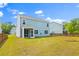 The backyard is flat, grassy, and fenced at 208 Cherry Grove Dr, Summerville, SC 29483