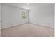 This bedroom has neutral paint, carpet and a window at 208 Cherry Grove Dr, Summerville, SC 29483